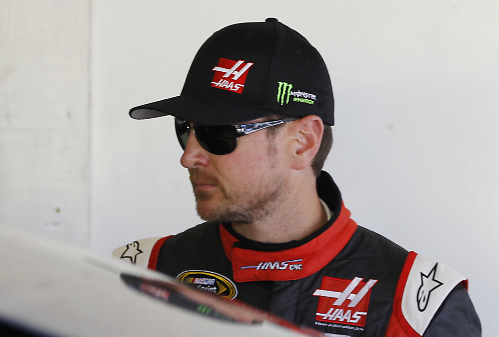 Kurt Busch stands in his garage during a practice session for the Daytona 500 on Wednesday.