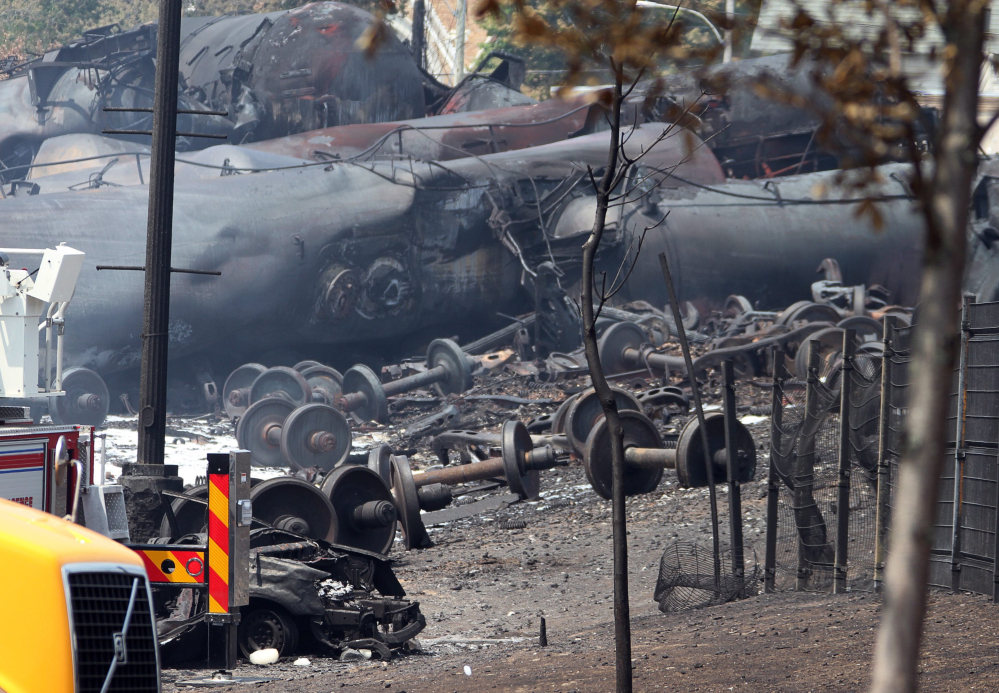 Debris is shown from a runaway train in July 2013 in Lac-Megantic, Quebec. As investigators in West Virginia and Ontario pick through the wreckage from the latest pair of oil train derailments to result in massive fires, U.S. transportation officials predict many more catastrophic wrecks involving flammable fuels in coming years absent new regulations.