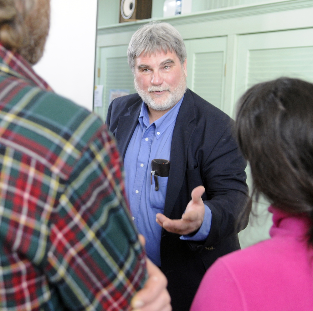 Arthur Spiess, an archeologist with the Maine Historic Preservation Commission, answers a question about the Dresden Falls Archaic Site after a meeting of the Dresden Historical Society on Sunday at Bridge Academy Public Library in Dresden.