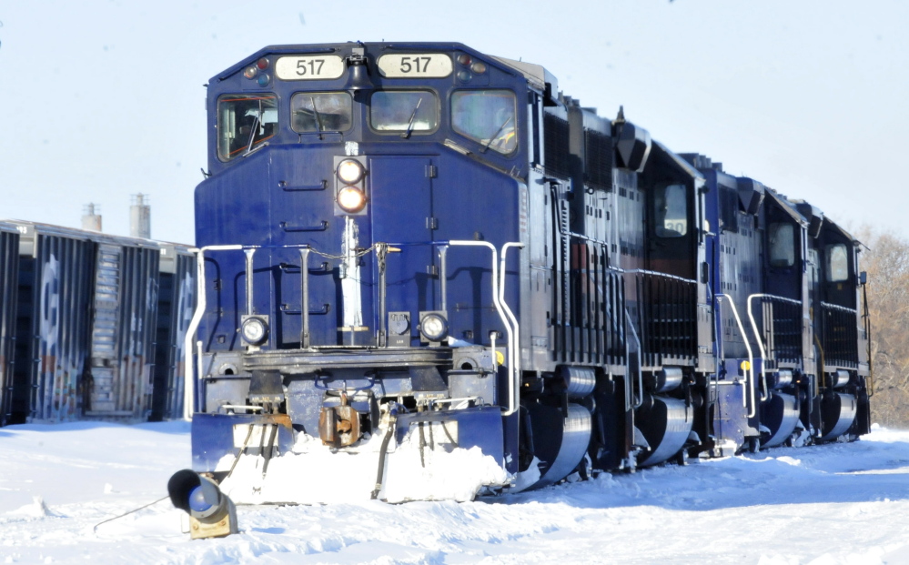 Two Pan Am Railways engines idle Monday at the Waterville yard, where the U.S. EPA says the company is facing $375,000 in civil penalties for violating federal and state environmental regulations.