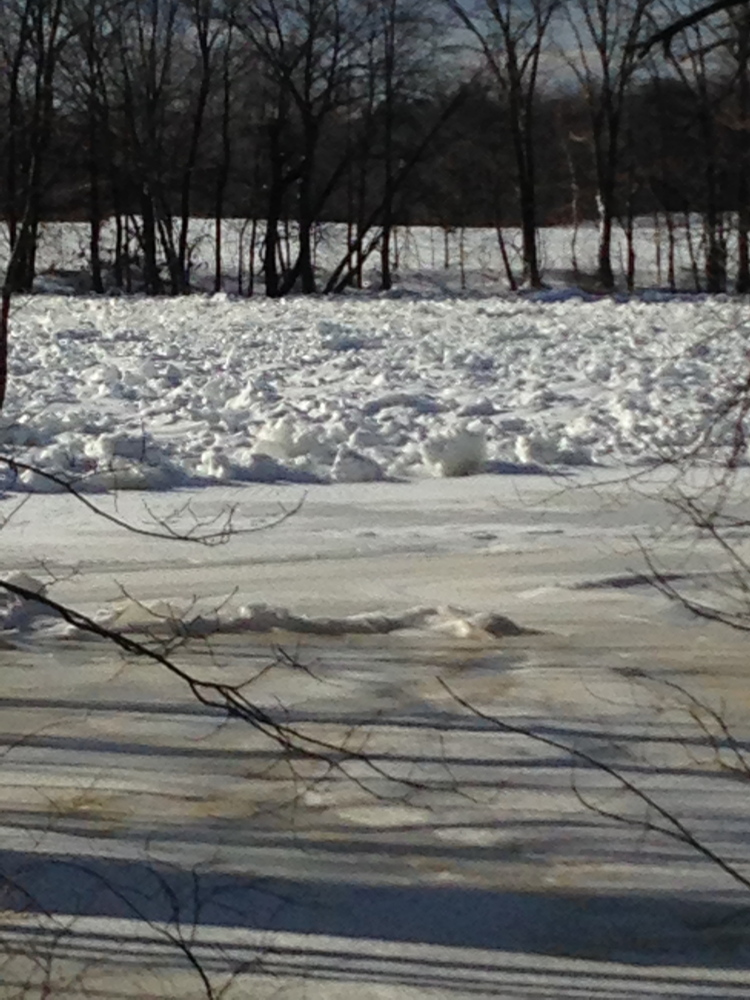 An ice jam on the Kennebec River in Madison, seen in a Jan. 28 photo, has experts worried that a rapid melting of snow might combine with the ice jams to cause spring flooding.