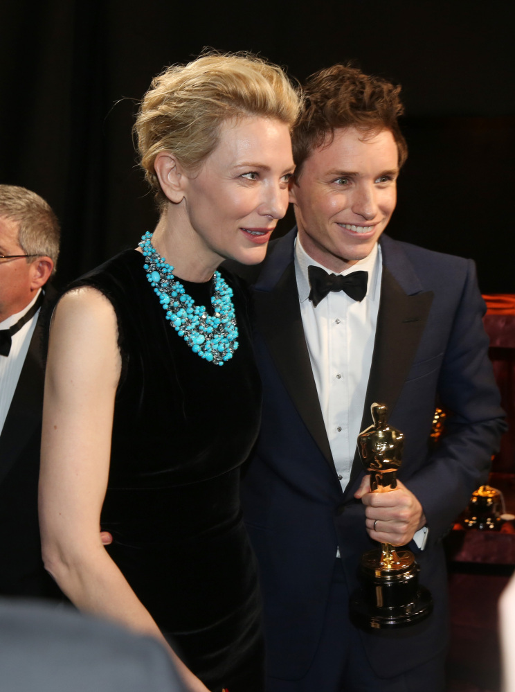 Cate Blanchett, left, and Eddie Redmayne appear backstage with his award for best actor in a leading role for “The Theory of Everything” at the Oscars on Sunday at the Dolby Theatre in Los Angeles..