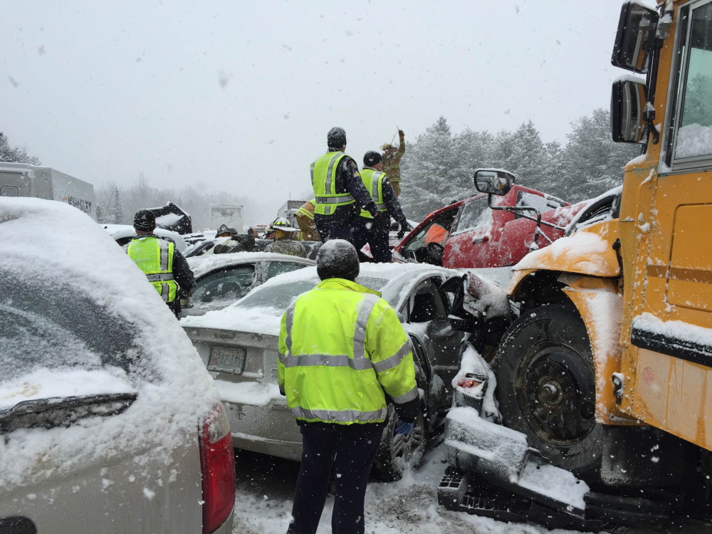 The bus belonging to RSU 19 in Newport landed on top of a car during the 75-vehicle crash on Interstate 95 in Etna Wednesday. Waterville EMT Allen Nygren, who performed triage at the scene in frigid weather wearing no gloves and a light jacket, said he was confounded that the car was crushed — with the exception of an  area around the driver, who was uninjured. Nygren said the car was so badly wrecked, “anybody in the back seat or the passenger seat would have been killed.”