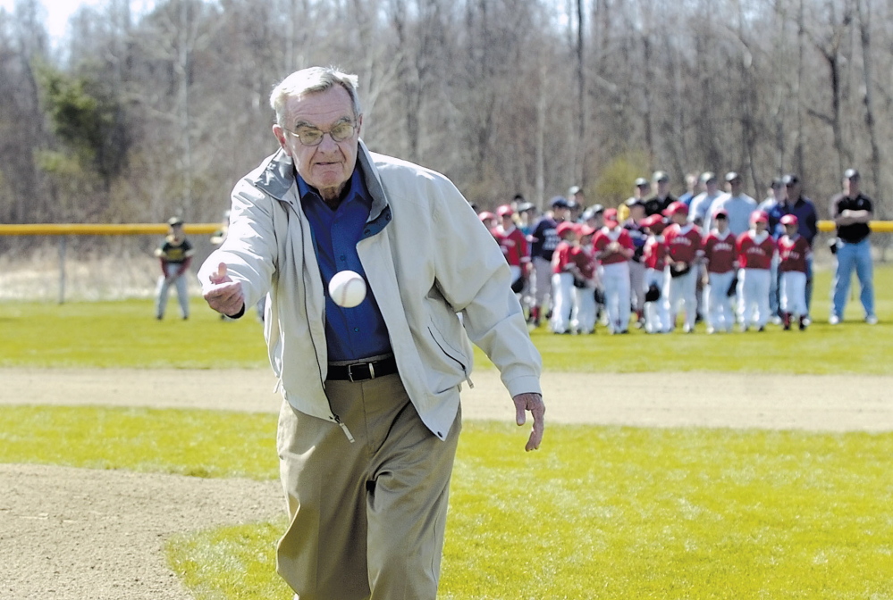 Dick McGee tosses the first pitch to open the 50th season of Police Athletic League baseball in Fairfield in 2007.