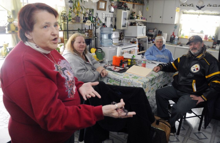 Deer Ridge Mobile Home Park co-op board secretary Beverly Chase, left, speaks during an interview on Thursday in Augusta. Other board members are vice president Donna Dennis, second from left, treasurer Gertrude Turcotte and president Mike Morissette.