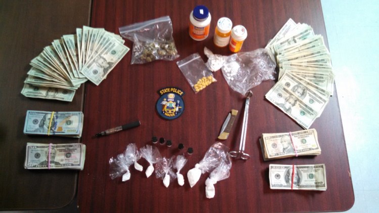 A traffic stop in Carthage led to the arrest of a Carthage man on Friday, when state police said they discovered marijuana, cocaine, prescription pills and a large amount of cash, shown above, in his vehicle.