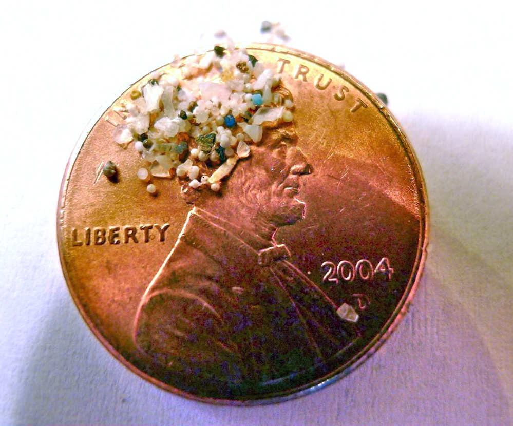 A sample of “microbeads” collected in eastern Lake Erie is shown on the face of a penny. Environmentalists say the tiny bits of plastic are wreaking havoc on fish and wildlife around the world. Many manufacturers agree and will begin to phase them out.