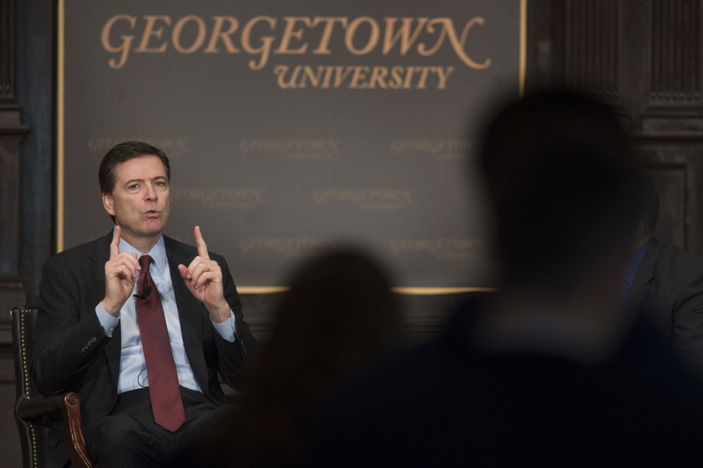FBI Director James Comey discusses race and law enforcement Thursday at Georgetown University in Washington. Comey said the nation is at a “crossroads” on matters of race relations and law enforcement, saying the country must confront “hard truths” following the deaths of Michael Brown and Eric Garner and the slayings of two police officers in New York.