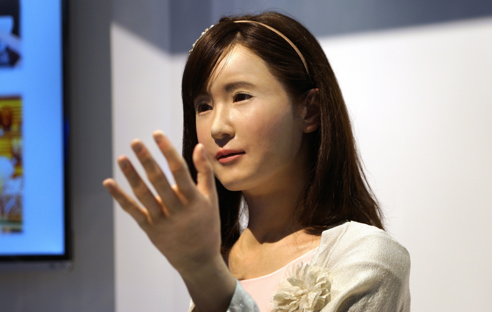 ChihiraAico, a communication android robot, gestures to visitors at the Toshiba booth at the International Consumer Electronics show  in Las Vegas  last month. More sophisticated machines can leave humans worse off, researchers say.
