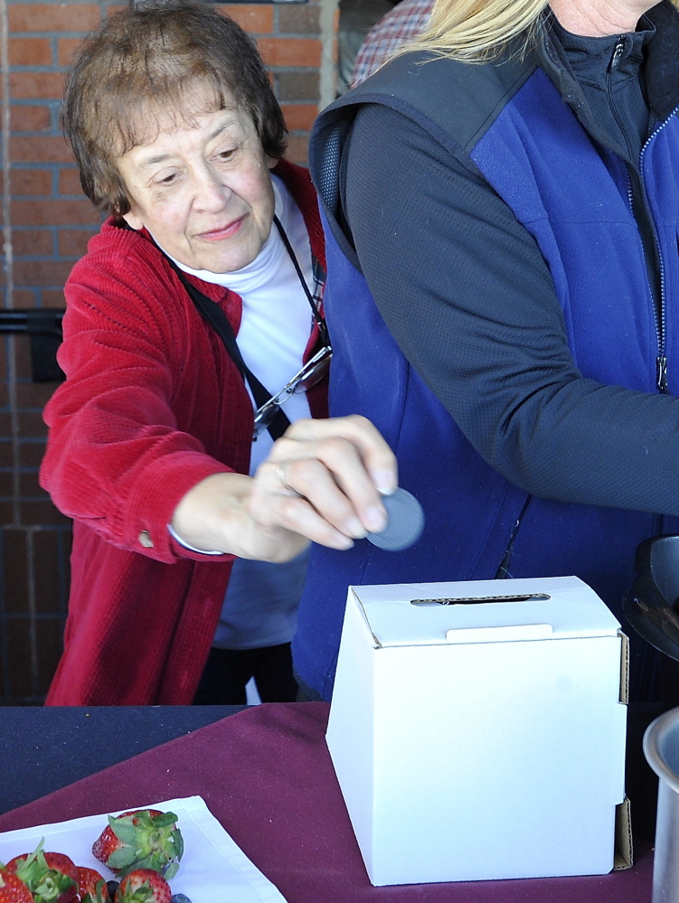 Martha Donahue of Portland casts her vote at the Incredible Breakfast Cook-Off held at the Sea Dog Brewing Company in South Portland on Friday.