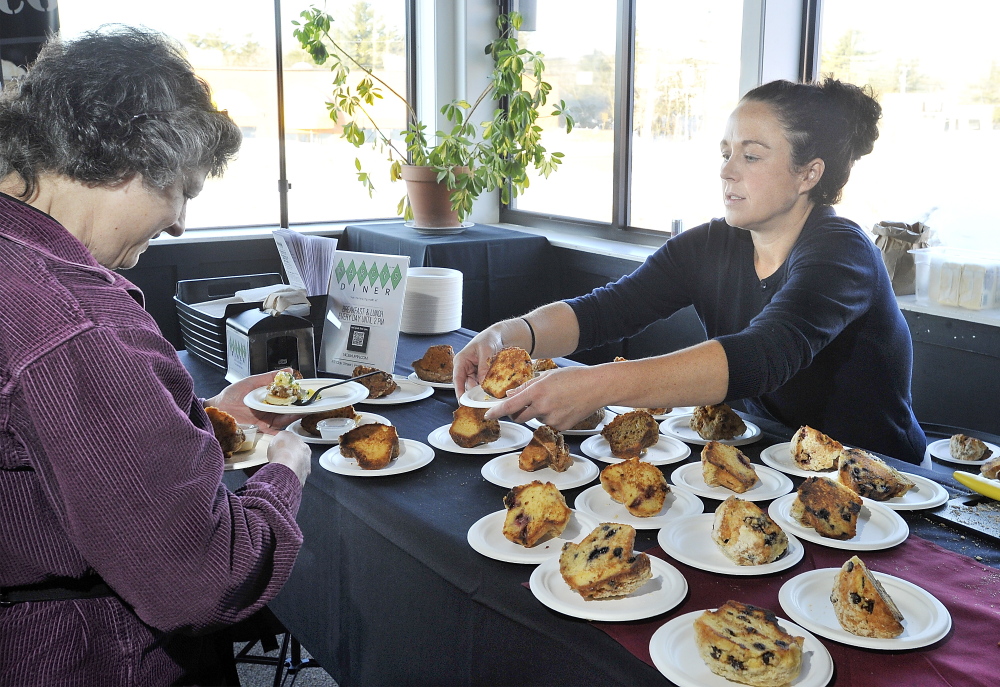 Alicia Gamow of Greene is offered a very tasty grilled muffin by Mandy Lacourse of Portland-based Marcy’s Diner.