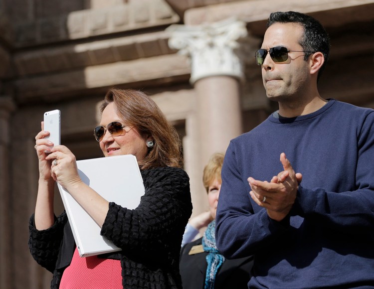 Cecelia Abbott, wife of Texas Gov. Greg Abbott,  left, and George P. Bush take part in the Texas Rally for Life in this 2015 file photo. Bush has endorsed Republican presidential candidate Donald Trump. Associated Press