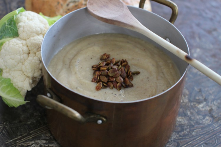 Cauliflower soup topped with tamari pepitas.