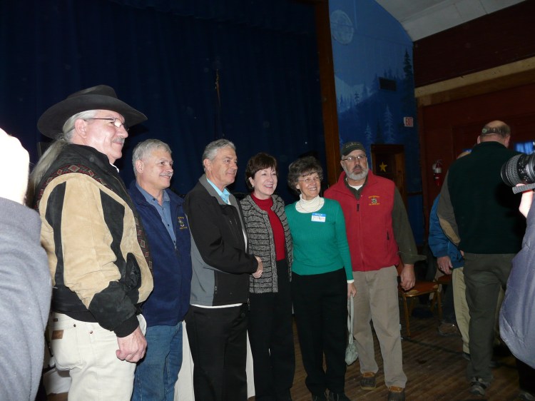 U.S. Department of Agriculture Deputy Under Secretary for Natural Resources and Environment Arthur “Butch” Blazer; Sen. Tom Saviello, R-Wilton; Linkletter Timberlands President Richard Linkletter; U.S. Sen. Susan Collins; Nora Linkletter; and Rep. Russell Black, R-Wilton, join 120 supporters of economic development and preservation Saturday at the Phillips Area Community Center in Phillips to celebrate the Orbeton Stream Project conservation easement, completed in December.