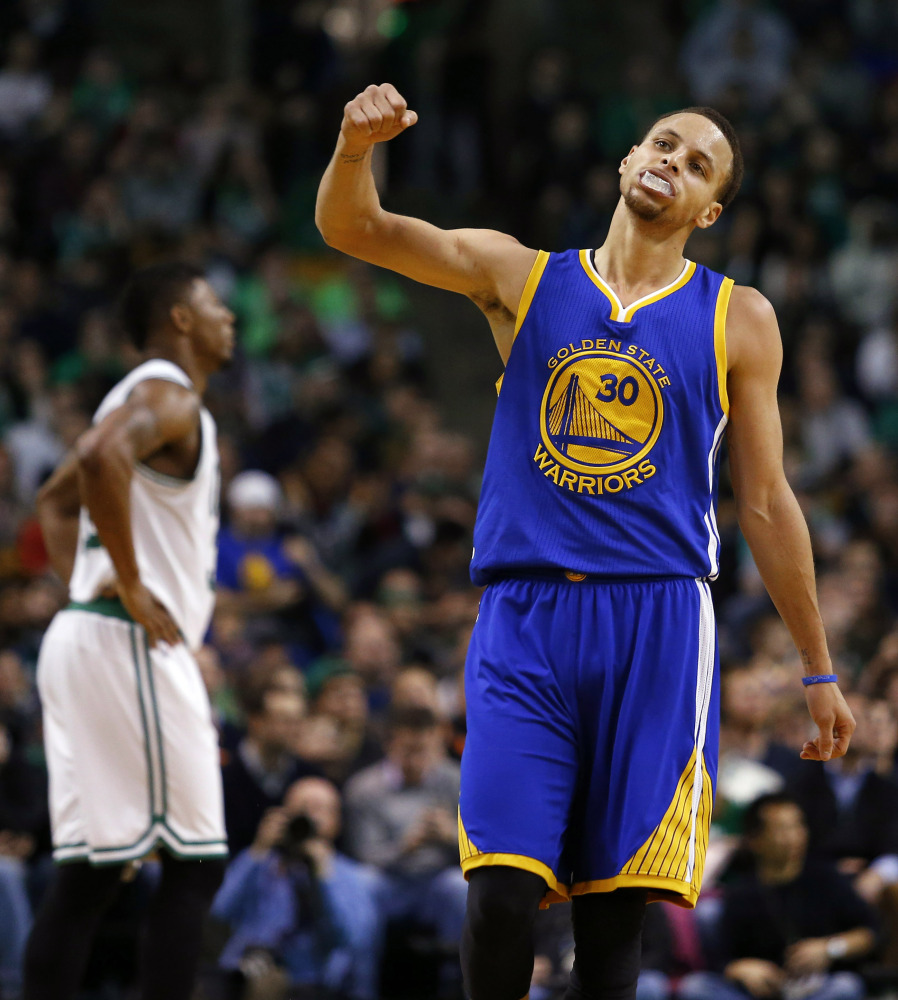 Golden State’s Stephen Curry pumps his fist after hitting a three point basket during the second half of the Warriors 106-101 win over the Boston Celtics on Sunday in Boston.