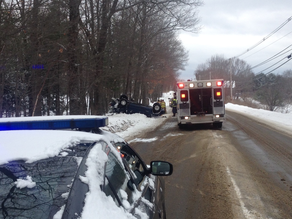 A Toyota Tacoma rests on its roof after an attempted U-turn on a slippery and snowy Cushman Road  resulted in the vehicle rolling over. A 28-year-old Rome man went to the hospital for minor injuries.