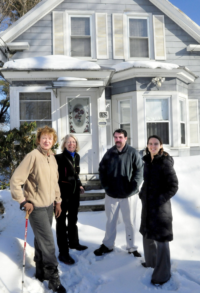 Staff photo by David Leaming
This home in Waterville may be the first bought by members of the Waterville Community Land Trust. The trust has an option to buy the home for $60,000 and and then refurbish it at an additional cost. At the home on Wednesday, from left, are Nancy Williams, City Planner Ann Beverage, Scott McAdoo and board chairwoman Ashley Pullen.