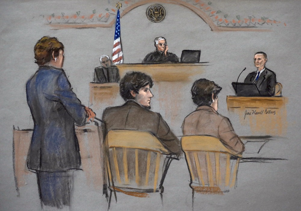 In this courtroom sketch, Bill Richard, right, is depicted testifying Thursday in the trial of Dzhokhar Tsarnaev. Tsarnaev, depicted sitting between defense attorneys Judy Clarke, left, and Miriam Conrad, second from right, is charged with conspiring with his brother to place two bombs near the Boston Marathon finish line in April 2013, killing three spectators including Bill Richard’s son Martin.