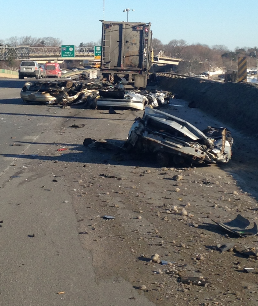 Morning traffic was backed up for miles after a tractor-trailer hauling crushed cars spilled part of its load onto Tukey’s Bridge in Portland on Friday. The cars and debris were clared by 8:45 a.m.