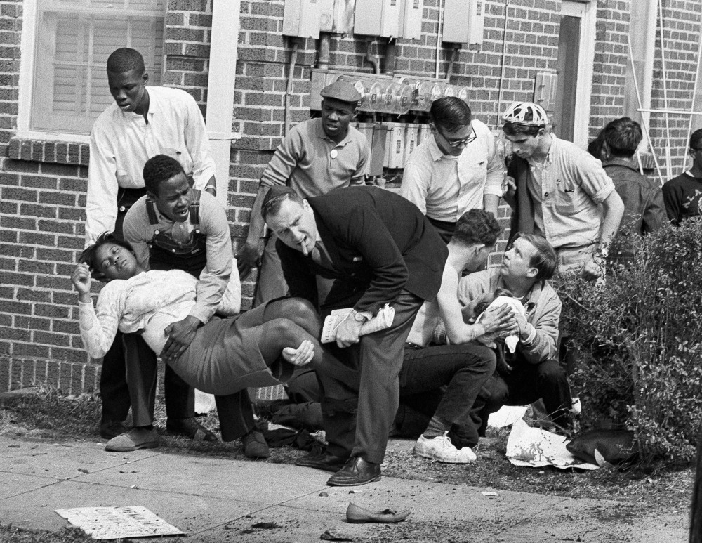 In this March 7, 1965, photo, Amelia Boynton is carried and another injured man tended to after they were injured when state police broke up a demonstration march in Selma, Ala. Boynton, wife of a real estate and insurance man, has been a leader in civil rights efforts. The day, which became known as “Bloody Sunday,” is widely credited for galvanizing the nation’s leaders and ultimately yielded passage of the Voting Rights Act of 1965.