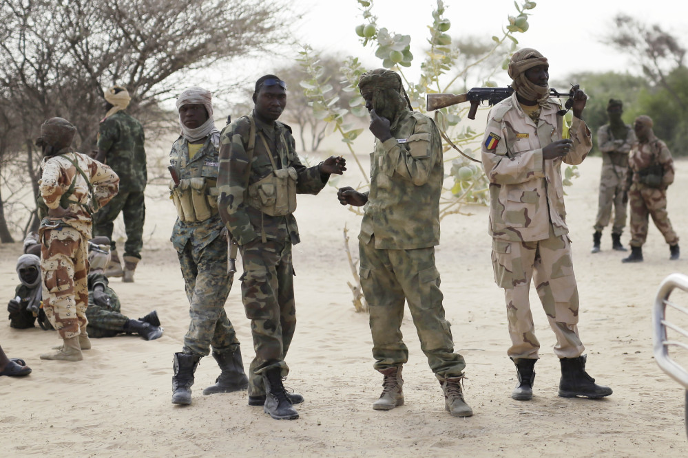 The Associated Press
Chadian troops previously stationed by the Sudanese border make a stop on their way to lake Chad near Baga Sola Friday.