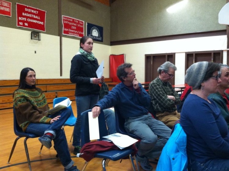 Sikwani Dana, a fourth-year student at the University of Maine at Farmington, stands to speak about fracking at Saturday’s Town Meeting in Solon. Voters adopted a moratorium on the practice, with exceptions.