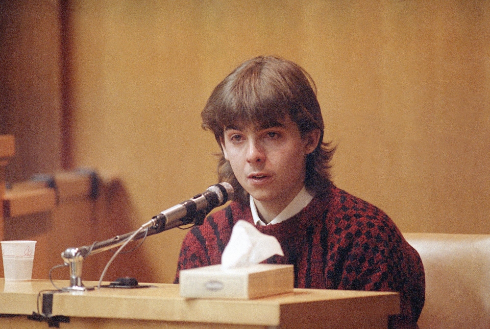In this March 13, 1991 photo, William Flynn, testifies on his 17th birthday how he shot Gregory Smart in the head and killed him, in court in Exeter, N.H. Smarts’ widow Pamela Smart was convicted and sentenced to life without parole for conspiring with Flynn to kill her husband. Flynn pleaded guilty to killing her husband and  has a parole hearing scheduled for Thursday.
