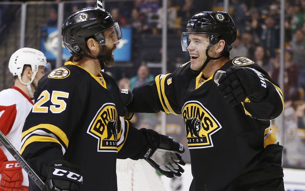 Daniel Paille, right, celebrates his second goal of the second period with Max Talbot during the Bruins’ 5-3 win over the Detroit Red Wings on Sunday.