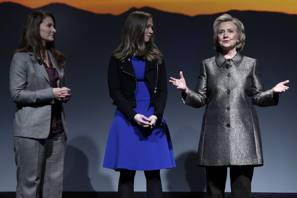 Melinda Gates, left, Chelsea Clinton, center, and Hillary Rodham Clinton participate in the “No Celings: The Full Participation Project,” in New York, Monday.