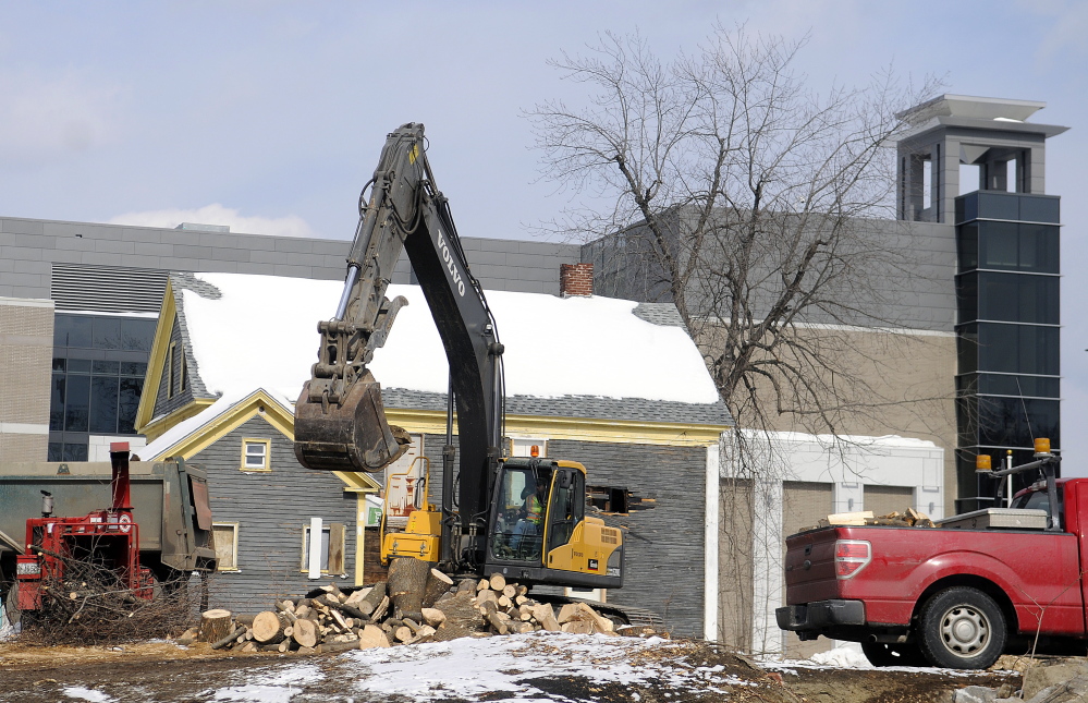 With the new courthouse in the background, this March 2 file photo shows one of four homes along Perham Street that was torn down to make way for more parking.