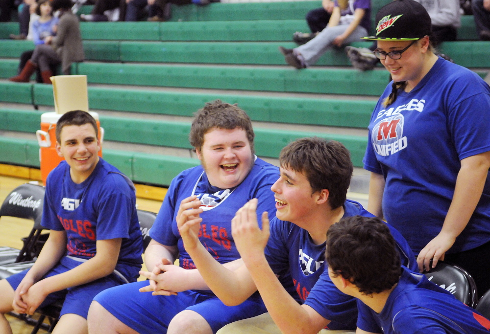 Members of the Messalonksee High School Unified team react to a basket during a quarterfinal against Winthrop on Tuesday afternoon. The top-seeded Ramblers edged the Eagles 55-50.