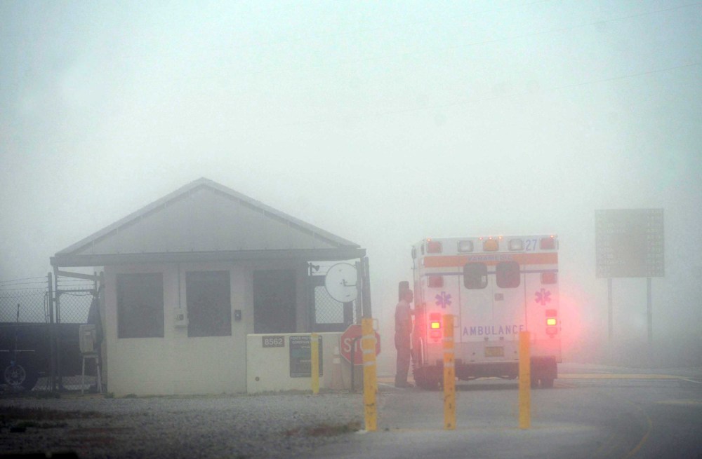 An Okaloosa County ambulance sits at the Eglin Air Force entrance in Fort Walton Beach, Fla., Wednesday.