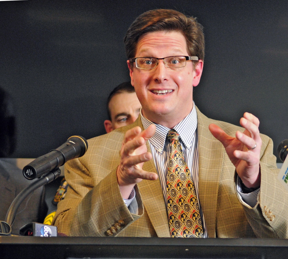 District Attorney for Androscoggin, Franklin and Oxford counties Andrew Robinson talks about the Financial Crimes Against the Elderly report during a news conference on Wednesday at the State House in Augusta.