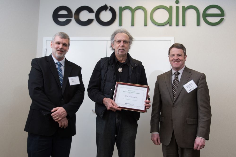 Waterville resident Stu Silverstein, center, accepts the 2015 eco-Excellence Award from ecomaine Recycling Committee Chairman Erik Street, left, and ecomaine CEO Kevin Roche.