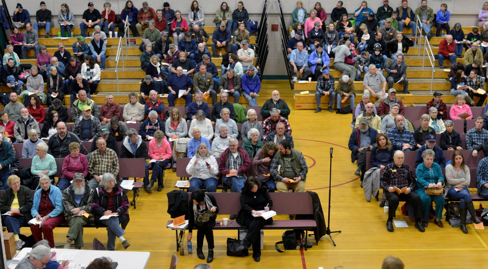 Voters participate in the annual town meeting at the New Sharon Elementary School on Saturday, March 7.
