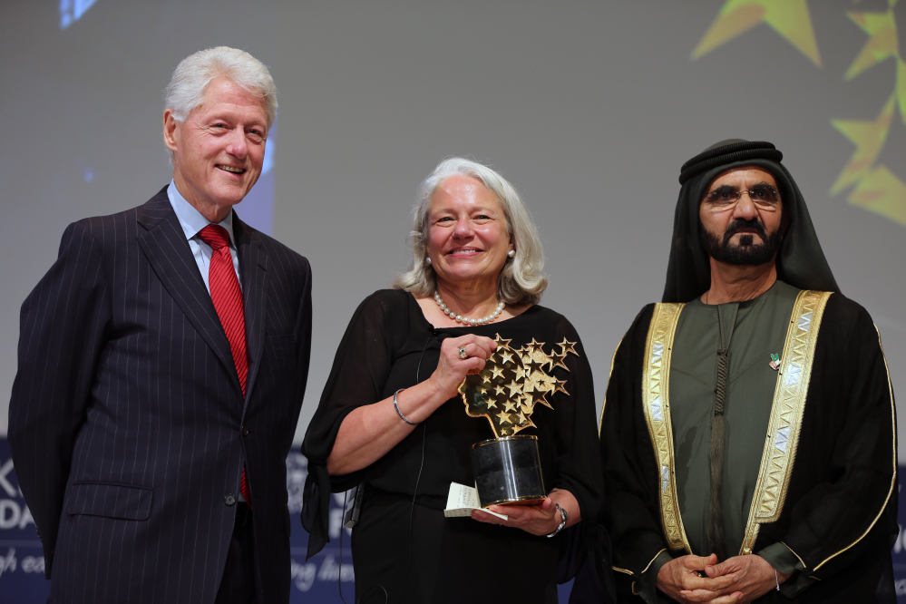 Nancie Atwell, a teacher from Southport, poses with former President of the United States Bill Clinton and Sheikh Mohammed bin Rashid Al Maktoum, prime minister of the U.A.E. and Ruler of Dubai, after she won the $1 million Global Teacher Prize in Dubai, United Arab Emirates, on Sunday.