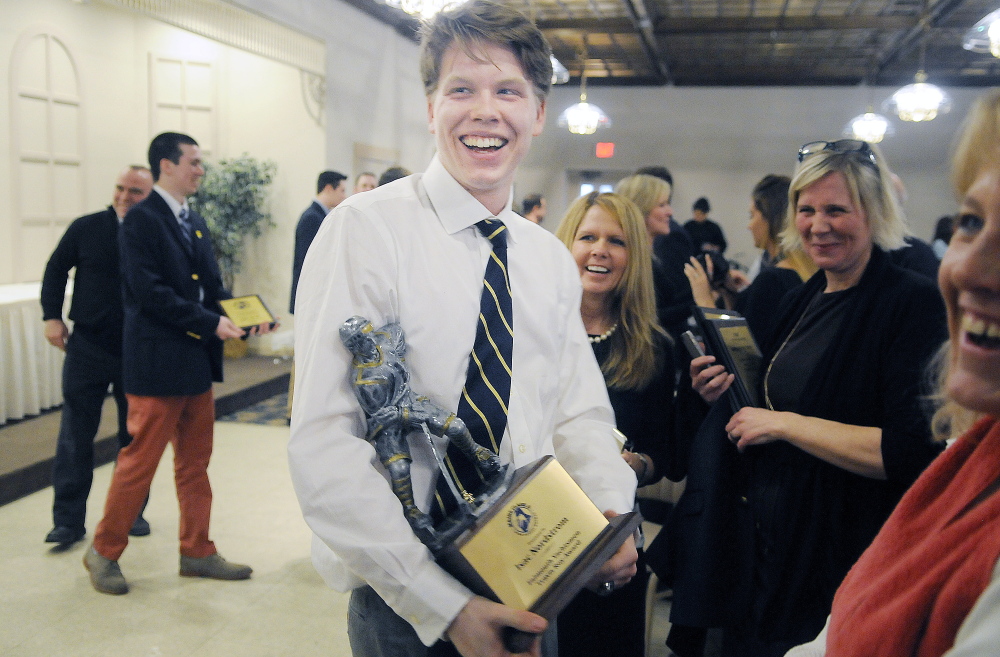 Falmouth High School’s Isac Nordstrom celebrates after receiving the Travis Roy Award on Sunday at a ceremony in Lewiston.