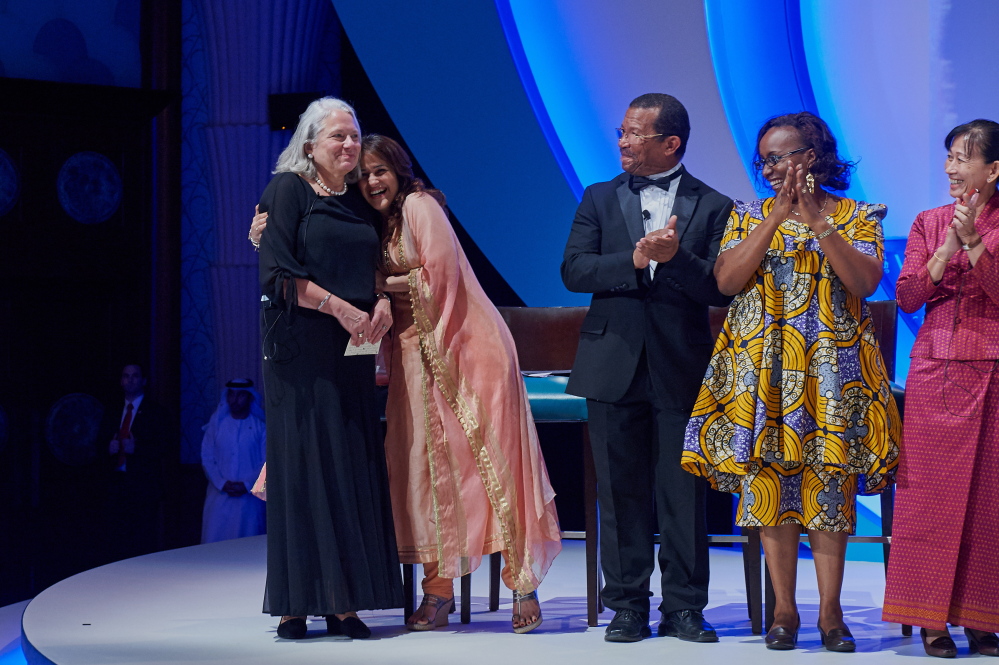 Nancie Atwell, a teacher at The Center for Teaching and Learning in Edgecomb,  is congratulated by Kiran Bir Sethi, a top 10 finalist of the Global Teacher Prize from India. Also pictured are Guy Etienne from Haiti, Jacque Kahura from Kenya, and Neang Phalla from Cambodia.