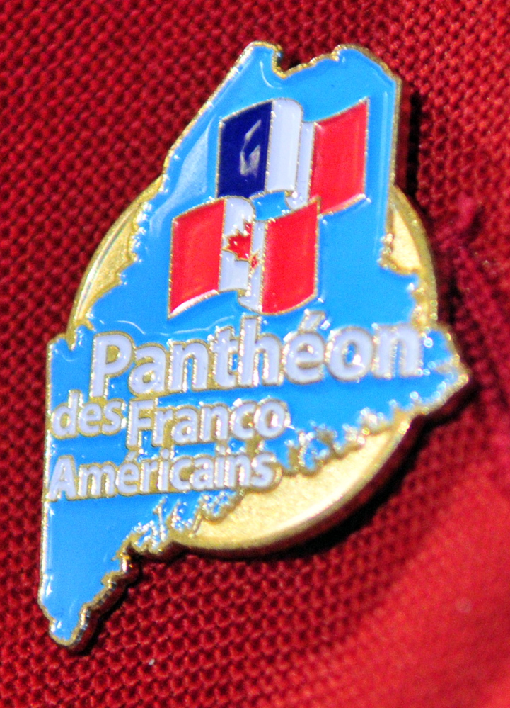 Maurice Pelletier of Augusta wears a pin that shows he was one of five new inductees into the Pantheon des Franco Americains, or Franco-American Hall of Fame, during Franco-American Day events on Wednesday in the State House Hall of Flags.