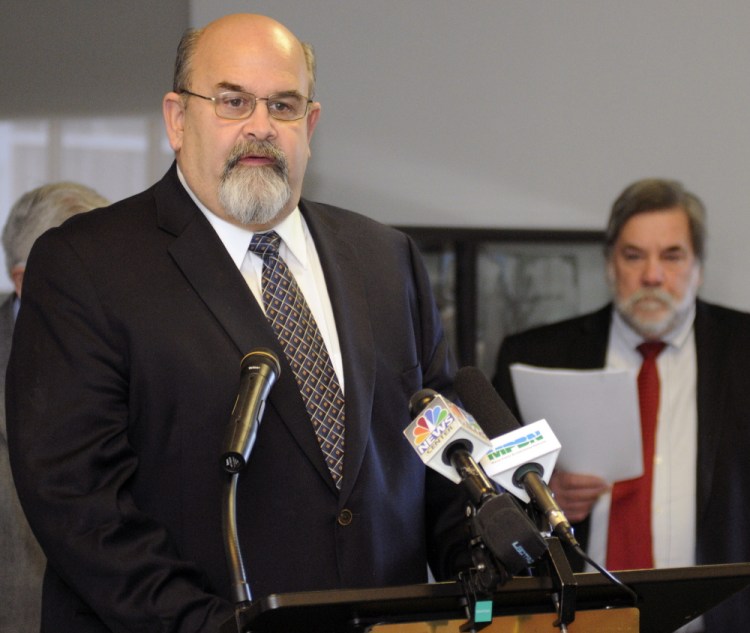 Augusta Mayor David Rollins speaks during a news conference hosted by the Mayors’ Coalition on Jobs and Economic Development, where they released a plan, “Cities of the Future,” on Wednesday at the State House. Gardiner Mayor Thom Harnett is in the background.
