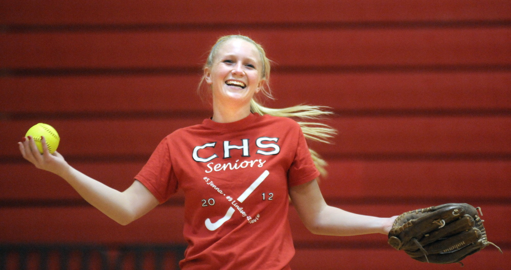 Staff photo by Andy Molloy 
 Cony High School pitcher Arika Brochu laughs at coach Rocky Gaslin during practice Monday. Pitchers and catchers began practicing Monday.