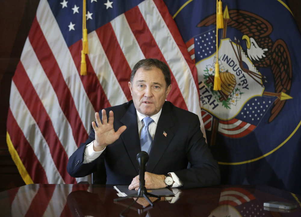 In this Feb. 5, 2015, file photo, Utah Gov. Gary Herbert speaks to members of the media during a news conference at the Utah State Capitol, in Salt Lake City.