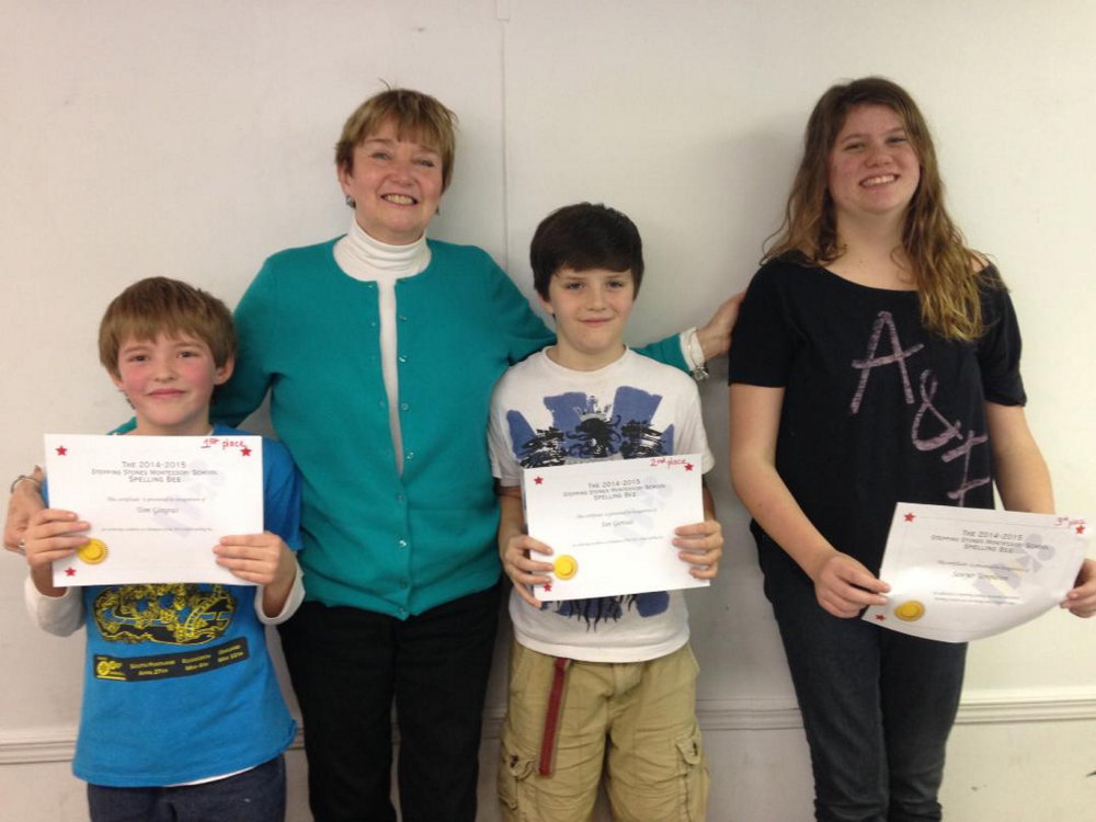 Kennebec County Spelling Bee, from left, Tom Gingras, winner; Su Locsin, school bee moderator; Ian Gervais, runner up; and Sawyer Templeton, third.