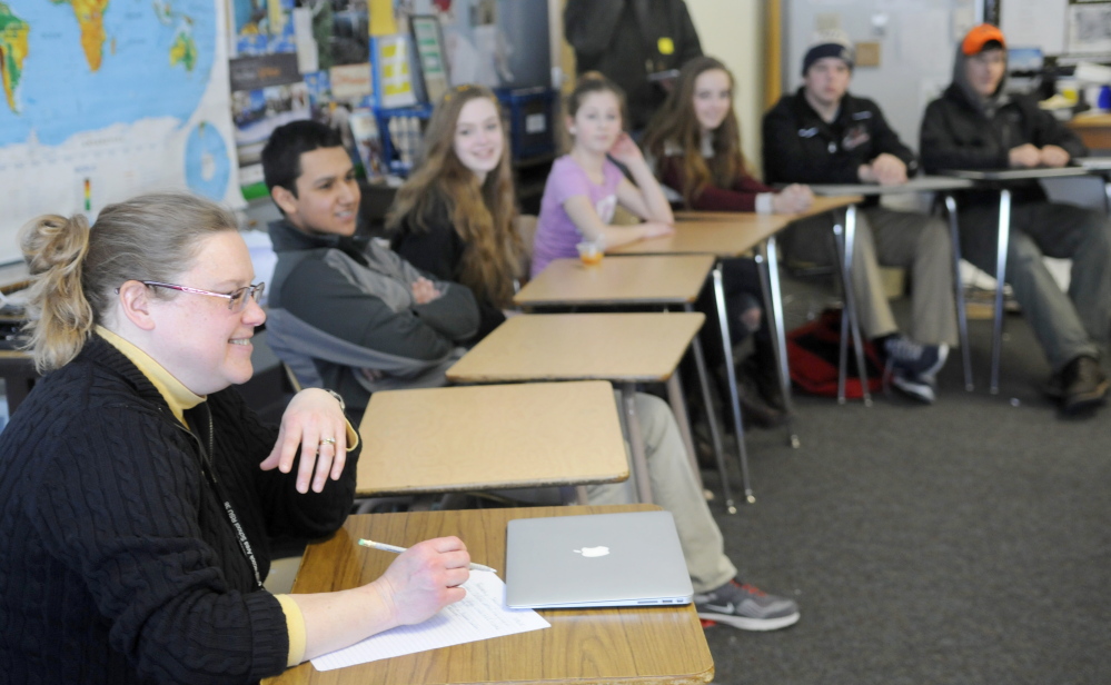 Maranacook Community High School teacher Carrie Emmerson leads a discussion Monday at the Readfield school about a stereotype workshop she attended with students recently.