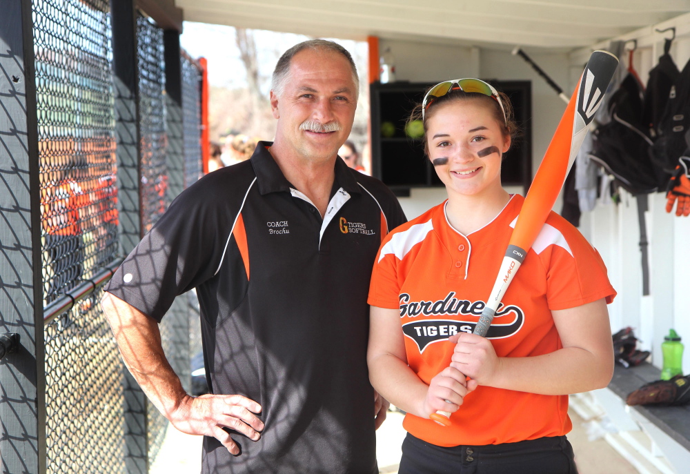 Photo by Jeff Pouland 
 Gardiner assistant softball coach Don Brochu poses with his daughter Brie before a game last year. Brochu returns as the head coach this season.