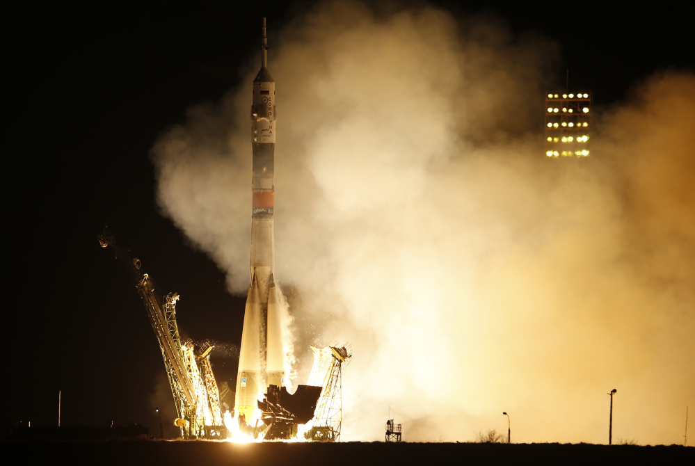 The Soyuz-FG rocket booster with Soyuz TMA-16M space ship blasts off at the Russian-leased Baikonur cosmodrome in Kazakhstan early Saturday. The Russian rocket carried U.S. astronaut Scott Kelly, and Russian cosmonauts Gennady Padalka and Mikhail Kornienko to the International Space Station.