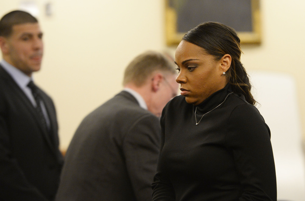 Shayanna Jenkins, fiancee of former New England Patriots football player Aaron Hernandez, seen at left, walks away after testifying at Hernandez’s trial on Friday in Fall River, Mass.