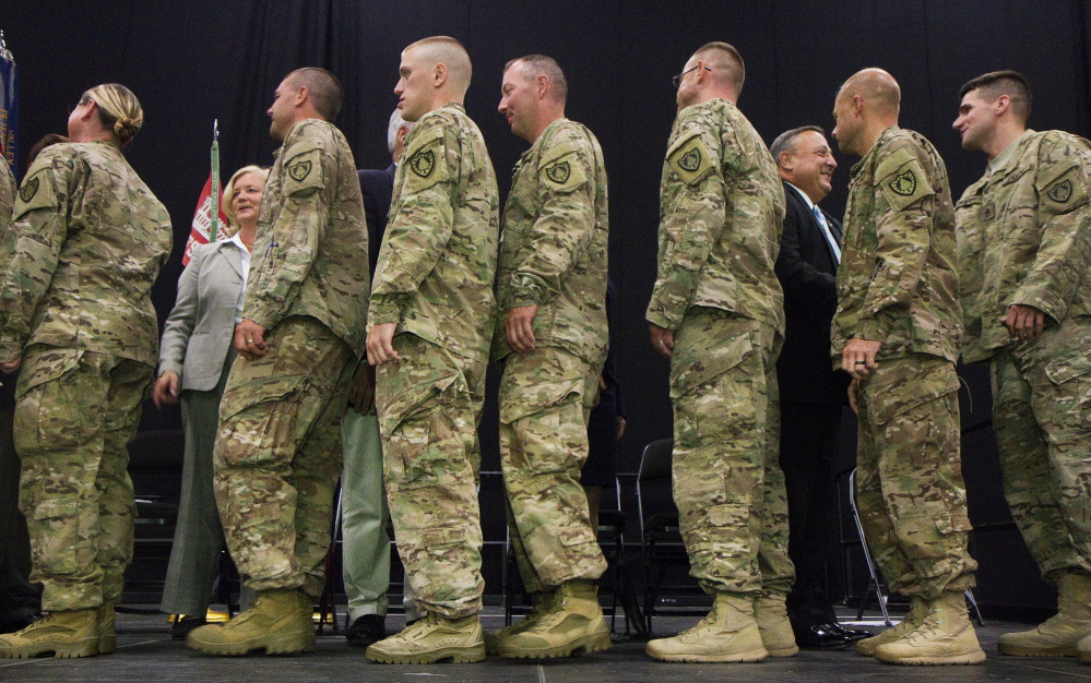 Members of Maine’s 133rd Engineer Battalion, back from deployment in Afghanistan, are honored during a ceremony at the Colisee in Lewiston on August 17. (Press Herald file photo by Carl D. Walsh