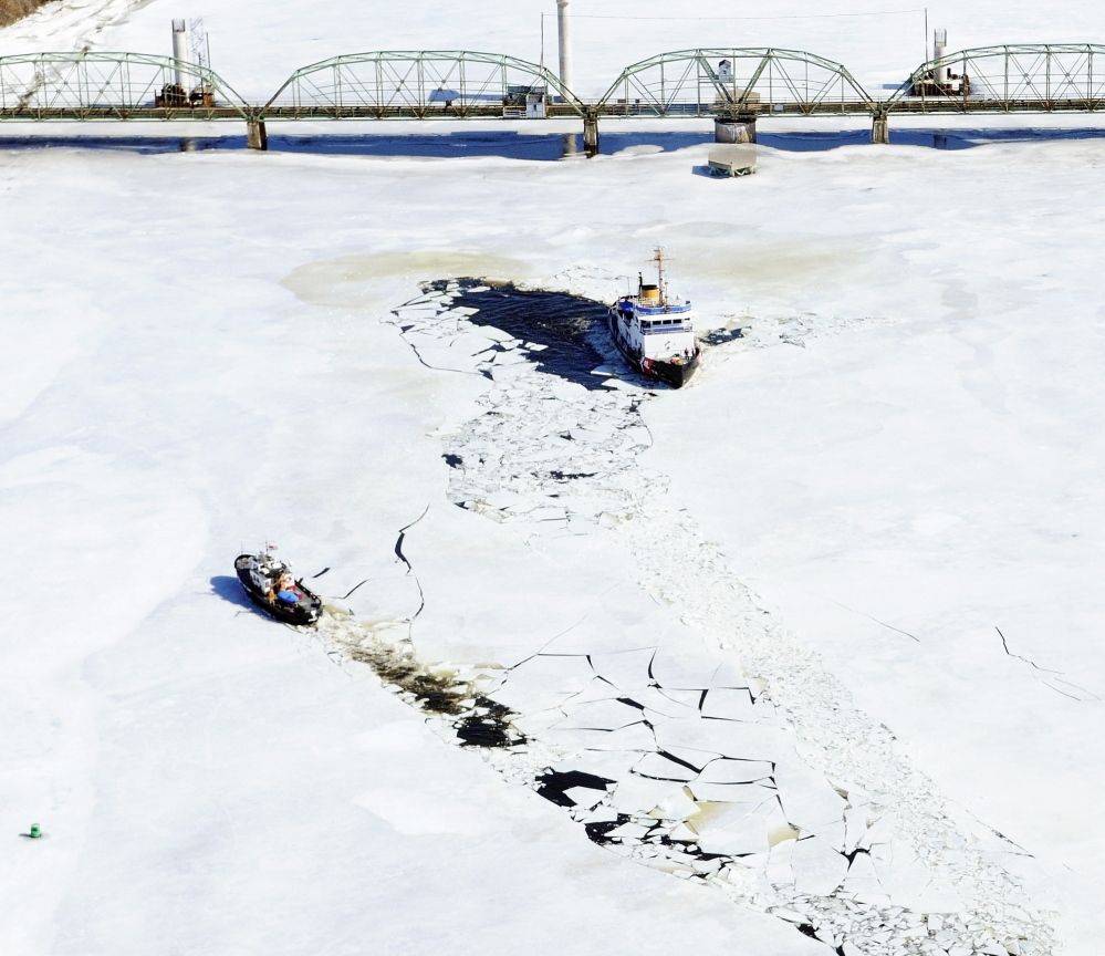 The 65-foot Coast Guard cutter Bridle, left and the 140-foot Coast Guard cutter Thunder Bay turn around last March near the old Richmond-Dresden Bridge on the Kennebec River.