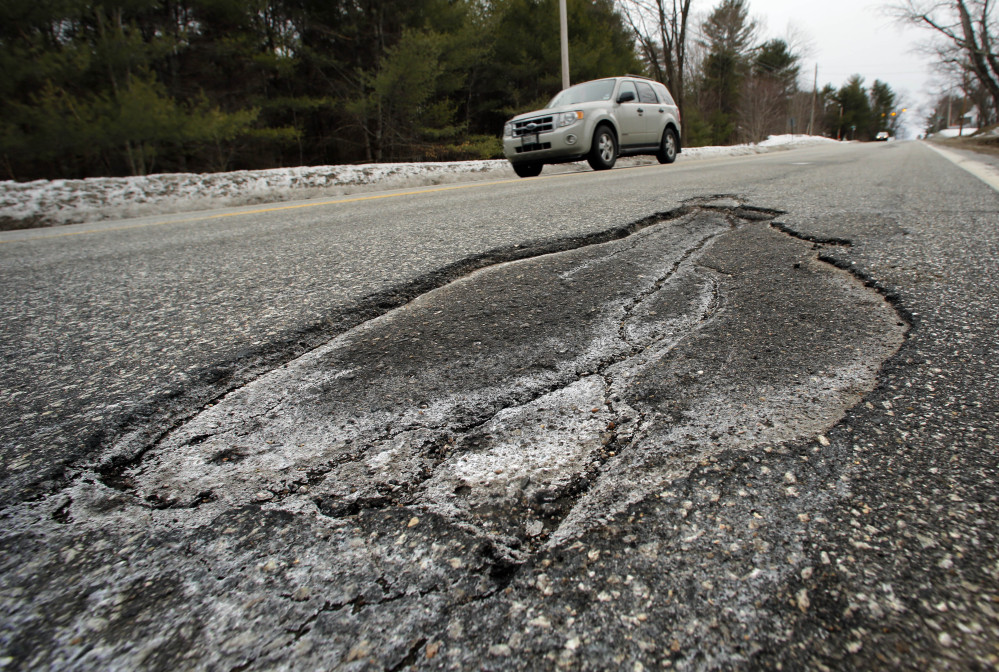 Potholes, like this one on Route 302 in Fryeburg, will plague New England this mud season. The expansion and contraction of asphalt during spring, when days are warm and nights are below freezing, will undoubtedly keep work crews busy repairing roads that have already been battered throughout the brutal winter experienced in northern New England.
